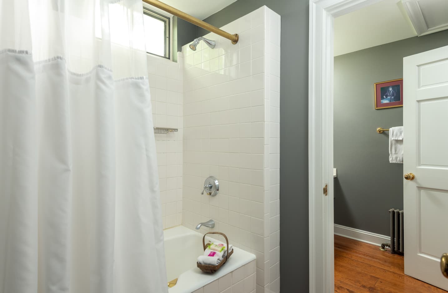 A bathroom with a shower and tub combo