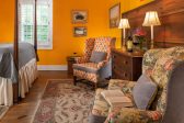 Seating area for two with a large wooden drawer and reading lamps