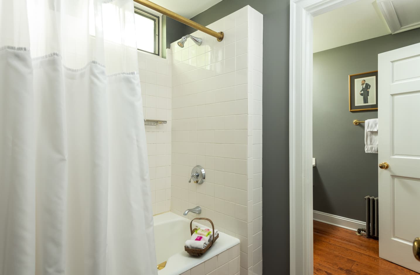 A bathroom with a shower and tub combo